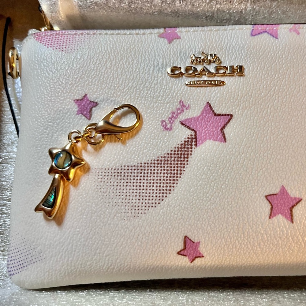 NWT Coach zip wristlet with strap and charm